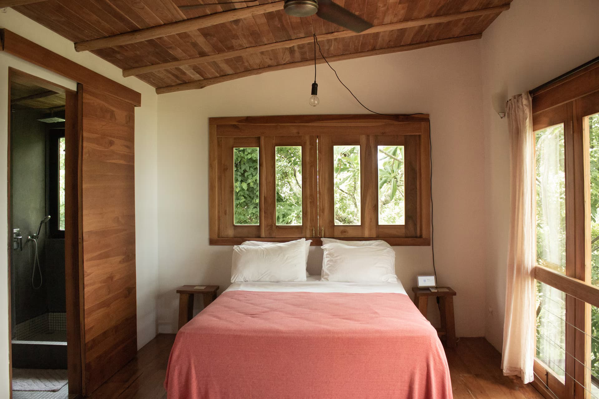 Open kitchen with sliding windows that bring the jungle inside